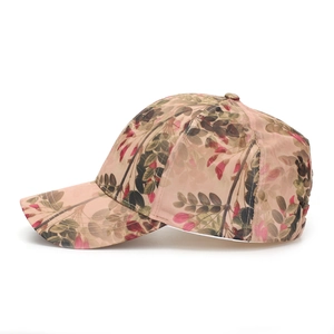Close-up of floral print pink mesh baseball cap showing breathable texture and stitching