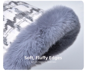 Detail of plush faux fur brim and classic black-white houndstooth fabric on winter hat