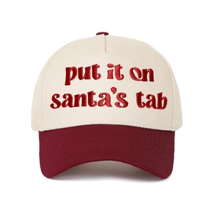 Detailed embroidery of 'Put It on Santa's Tab' on a two-tone cotton baseball cap