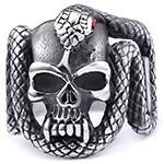 Macro shot of gothic ring detailing snake scales and skull in antique steel