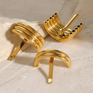 Three gold-plated stainless steel U-shaped hair pins with minimalist geometric designs