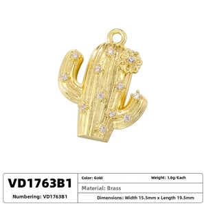 Detailed view of a gold brass cactus pendant with pave-set cubic zirconia crystals