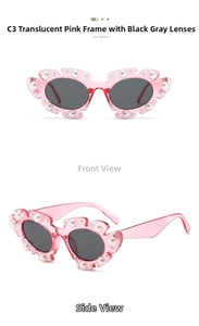 Cat eye sunglasses in transparent pink with white pearls and dark grey lenses detail