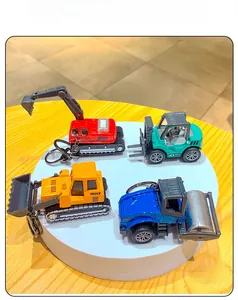 Detailed set of four mini alloy construction vehicle keychains on a display stand