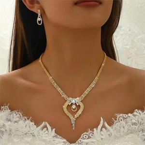 Golden bridal jewelry set with sparkling rhinestone fringe necklace and heart earrings