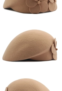 Detail view of camel wool beret with side flower accents and premium felt texture