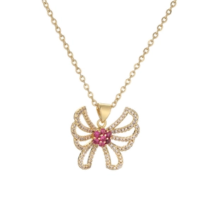 Gold butterfly necklace with pink and clear crystals pendant on a white background