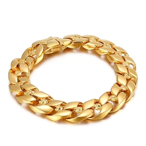Gold Cuban link bracelet for men with skull details and a secure fold-over clasp