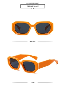 Detail view of bold orange square sunglasses with dark lenses and thick angular frames