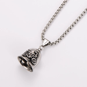 Detailed close-up of retro silver stainless steel biker bell pendant with embossed design