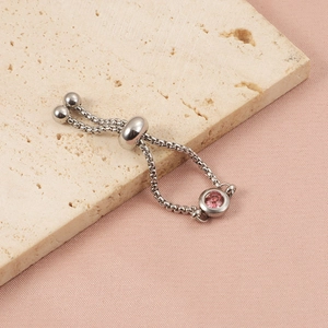 Macro view of silver adjustable box chain ring with pink round zircon stone