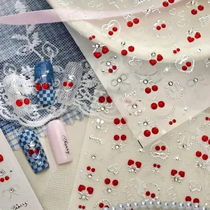 Sweet cherry nail art stickers with silver hearts and glitter accents for manicures