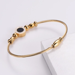 18k gold plated stainless steel wire bracelet with black cubic zircon crystal accents