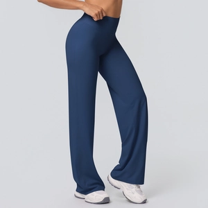 Side view of dark blue high-waisted flare yoga pants showing draping and elastic fabric