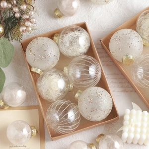 Champagne and white Christmas ball set in kraft box with glitter and feather textures