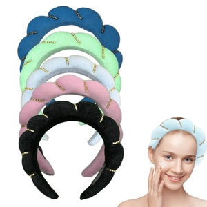 Detail showing colorful twisted sponge headbands with small gold beads in multiple colors