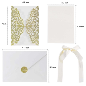 Detailed view of laser-cut gold glitter invitation set with envelopes and ribbon