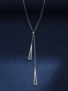 Detail of adjustable silver Y-shaped box chain necklace with geometric hollow triangles