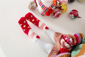 Thick warm coral fleece Christmas socks for kids featuring cute snowman and gift decorations