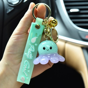 Cute resin octopus keychain with light-up feature for car and backpack decoration.