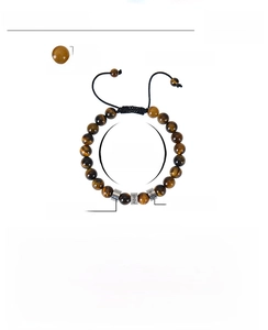 Macro detail of custom name tiger eye stone beads on adjustable braided bracelet