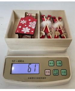 Detailed view of wooden Christmas sled and skis ornaments set weighing 61 grams