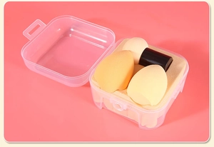 Three-piece makeup sponge set with teardrop blenders and a handled puff in a clear storage box