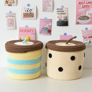 Detailed view of handmade cotton rope woven baskets with decorative lids and cute patterns