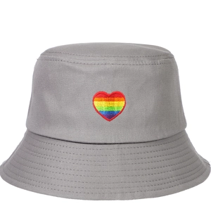 Close-up of grey bucket hat featuring rainbow heart embroidery detail