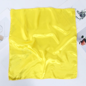 Detailed view of square yellow satin neckerchief with professional rolled edges