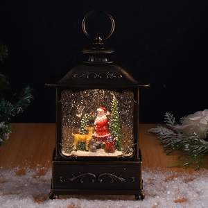 Close-up of bronze Christmas lantern with Santa, reindeer and swirling snow scene