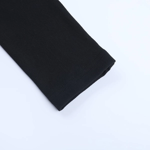 Detail of double-needle stitching on black square-neck long-sleeve knit mini dress