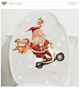 Close-up of Santa Claus riding a motorcycle on a festive Christmas toilet lid sticker
