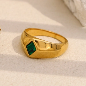 Macro shot of 18K gold plated ring with a green rhombic malachite stone inlay