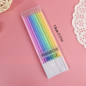 Detailed view of 14cm rainbow spiral candles in a 10-pack gift box on pink backdrop