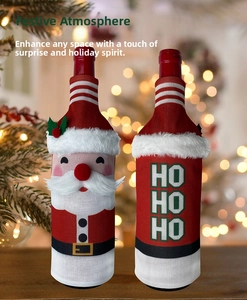 Macro detail of knitted Santa wine bottle covers with 3D beard and HO HO HO pattern
