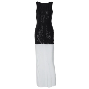 Detail of elegant black sequin bodice and flowing white pleated skirt of the long dress