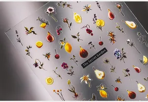 Macro detail of The Secret Garden nail stickers featuring fruit and flower motifs