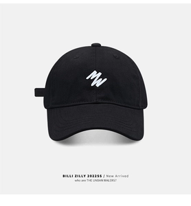 Close-up of black cotton baseball cap featuring detailed white MW letter embroidery