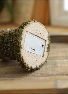 Detail of the bottom battery compartment and power switch on the wooden tree house lamp