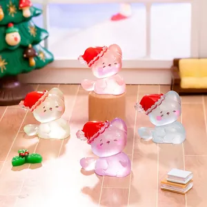 Luminous Christmas cat figurines in miniature festive room setting for holiday desk decor