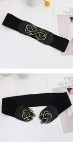Detail of vintage hollow flower buckle on black elastic waist belt for women