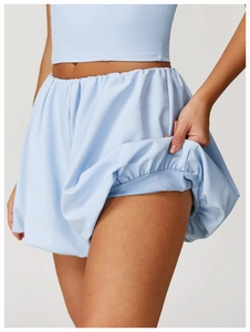 Detail of light blue athletic skort with built-in liner for yoga and tennis
