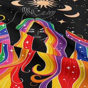 Detailed close-up showing soft fabric texture of a bohemian tapestry with celestial art