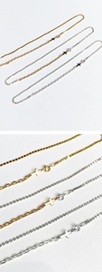 Detail view of gold and silver minimalist cross pendant necklaces with clasp details