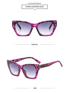 Detail view of purple leopard cat eye sunglasses with gray gradient lenses
