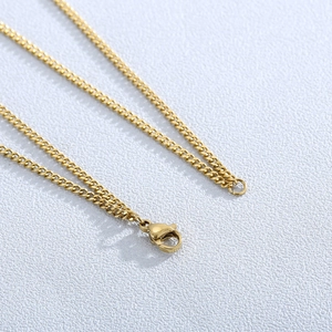 Gold-plated stainless steel double-layered necklace with heart pendant and lobster clasp
