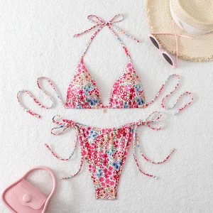 Two-piece floral bikini set with halter top and side-tie bottoms for summer vacation