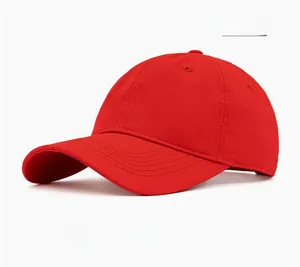 Close-up of bright red cotton baseball cap showing twill fabric and stitched eyelets
