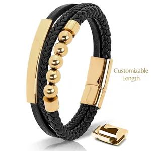 Detail view of multi-layer black leather bracelet with gold beads and magnetic steel clasp